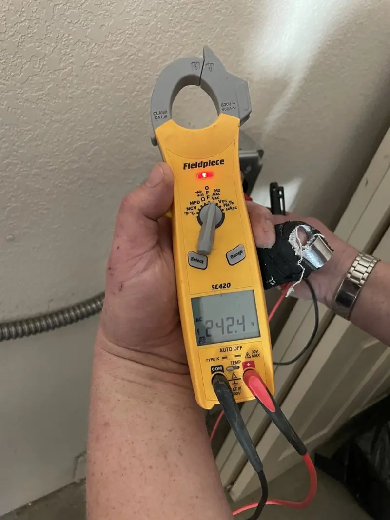 Voltage testing with clamp meter during Generator Installation in Bystrom